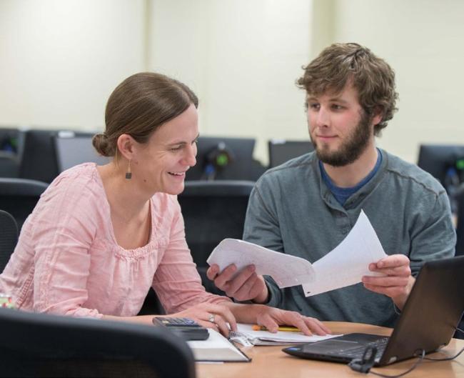 Two students working together at a computer